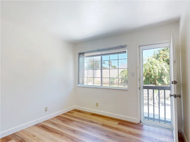 Bedroom #2, with access to the back yard