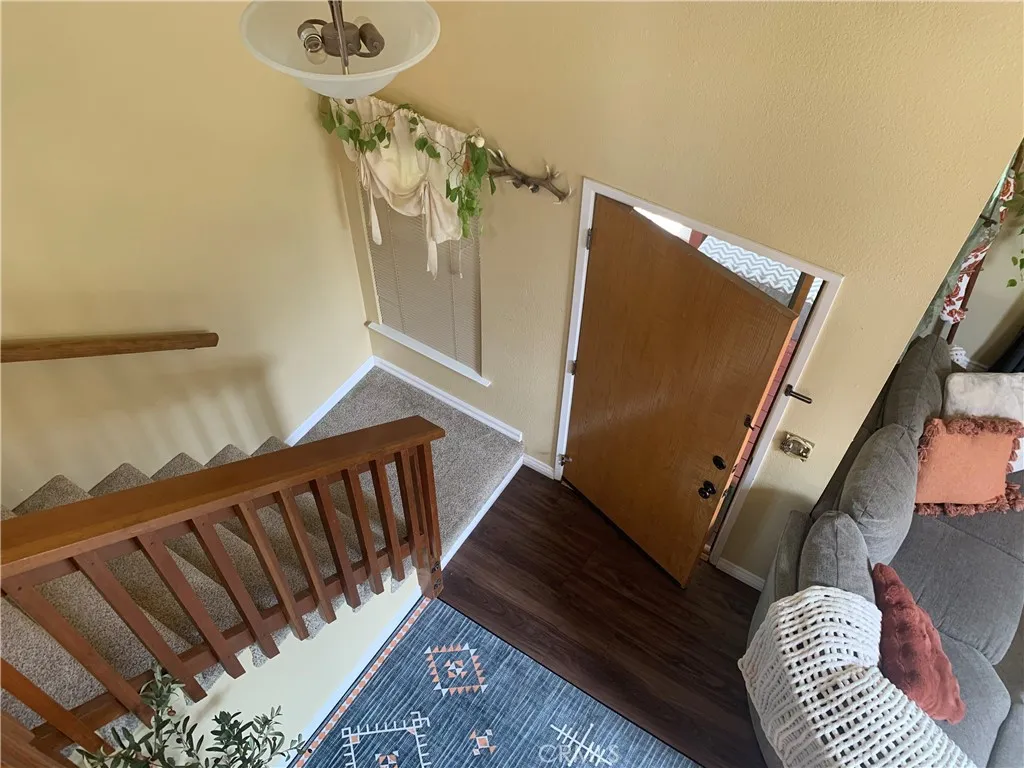 Stairs coming down from Bedrooms/ Baths.