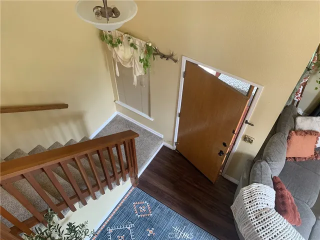Stairs coming down from Bedrooms/ Baths.