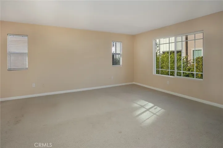 The spacious primary suite serves as a peaceful escape, complete with a large walk-in closet and a private en-suite bath.
