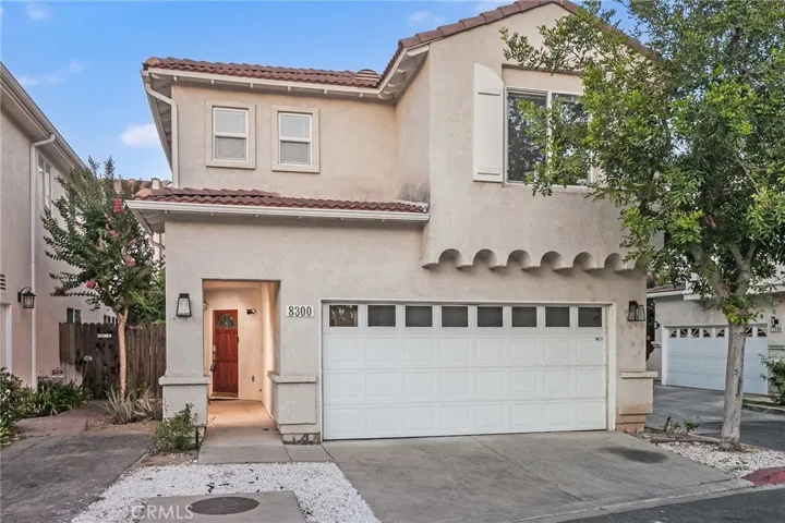  A covered portico welcomes you home, where soaring two-story ceilings and abundant windows immediately create a bright, open atmosphere. Recessed lighting, two-tone designer paint, wood and tile flooring, and a thoughtfully designed floor plan create inviting spaces that feel both comfortable and functional for everyday living.