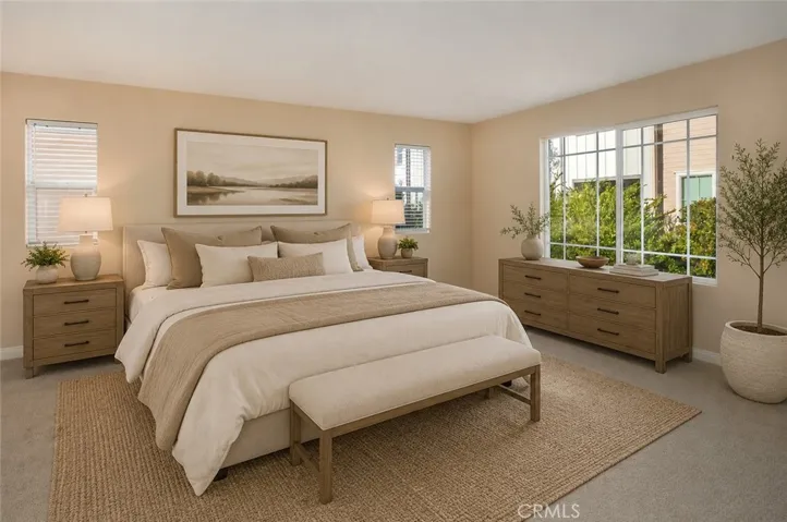 Photo is virtually staged.  Previous photo is how property currently shows. The spacious primary suite serves as a peaceful escape, complete with a large walk-in closet and a private en-suite bath.