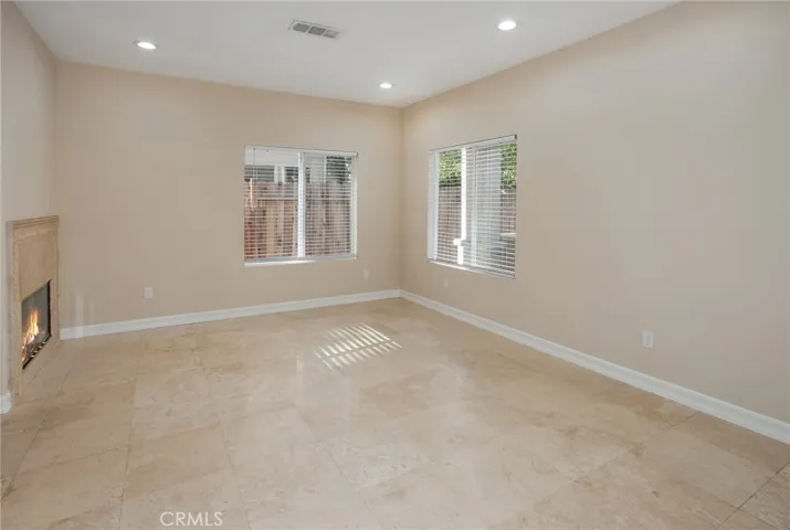 At the heart of the home, the oversized family room is where everyday life comes together. Centered around a cozy fireplace and open to the kitchen, it's easy to picture everything from movie nights and weekend football to quiet evenings spent together.
