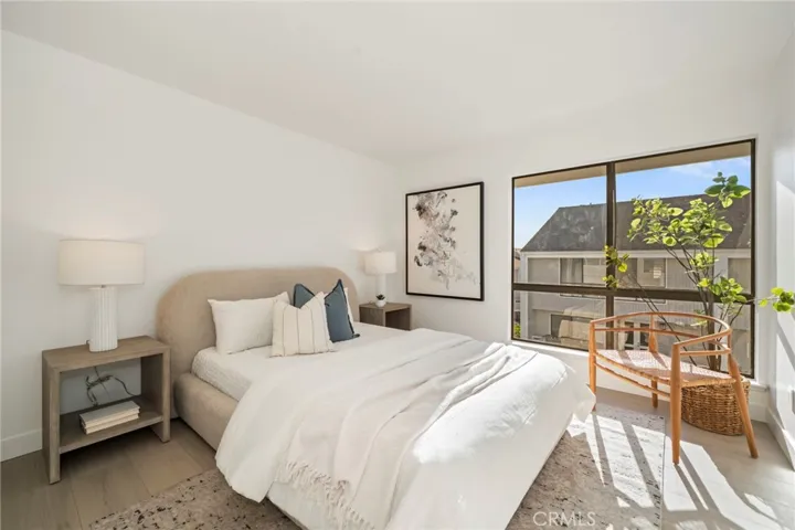 Guest bedroom with partial ocean glimpse