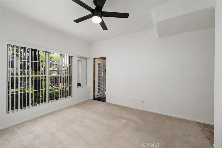 Primary Bedroom w/ Door that leads to patio