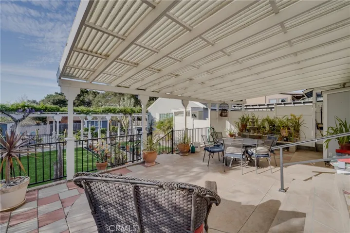 serene covered backyard patio off of dining room.