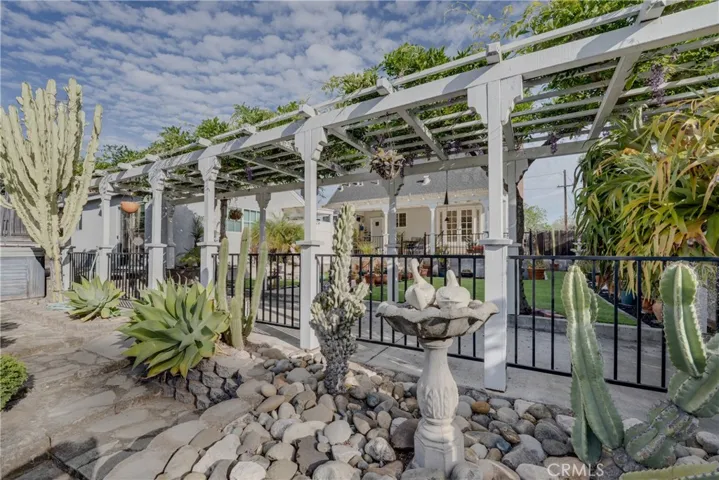 Arbor toward back of house patio.