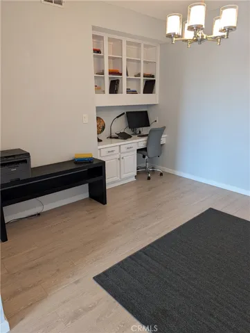 Den with built in desk and cubby spaces