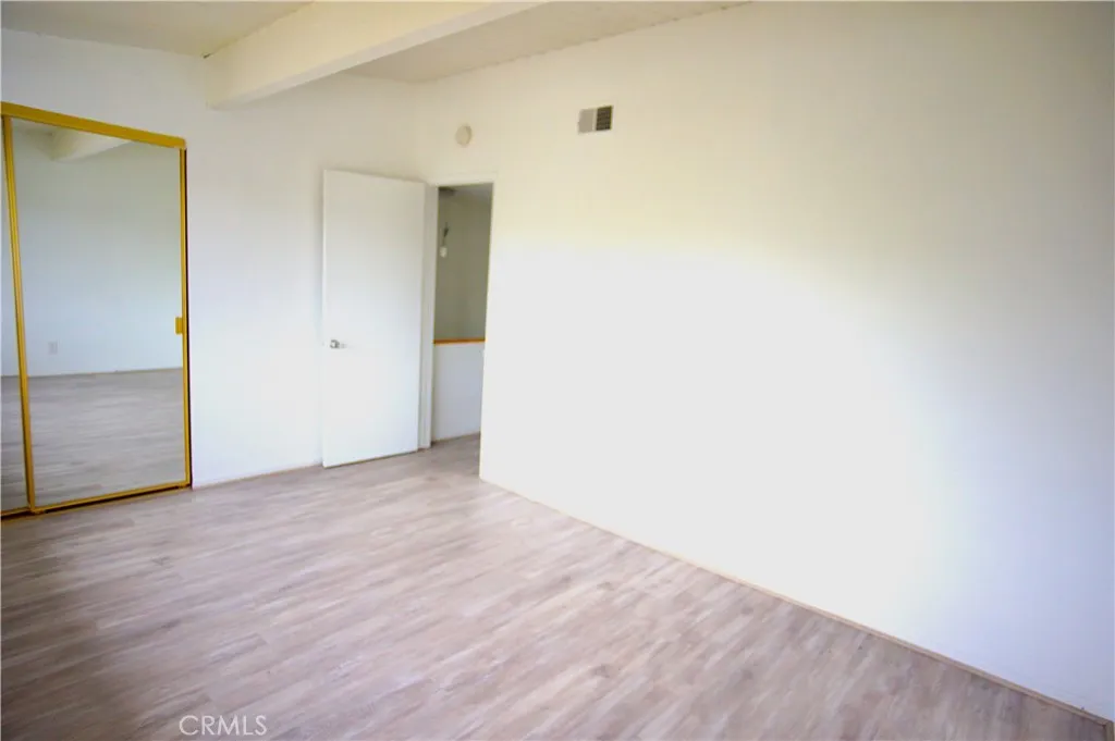 BEDROOM 1 MIRROR CLOSET DOORS