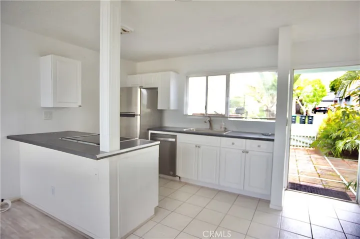 KITCHEN LOOKING OUT TO FRONT YARD