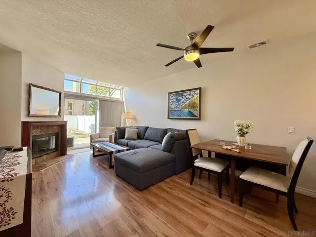 Open concept living room / dining room combo is open to the kitchen and has access to the backyard, and the downstairs bedroom and full bathroom.