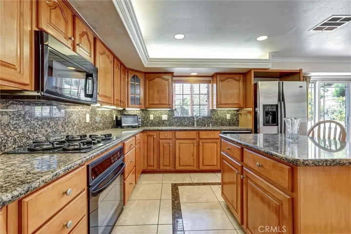 Chef's Kitchen with Tons Of Granite Countertop Space