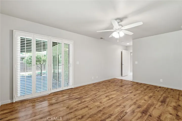 Primary bedroom with backyard access.
