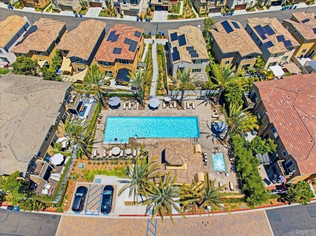 Overhead view of the community pool, spa, and outdoor lounge areas.