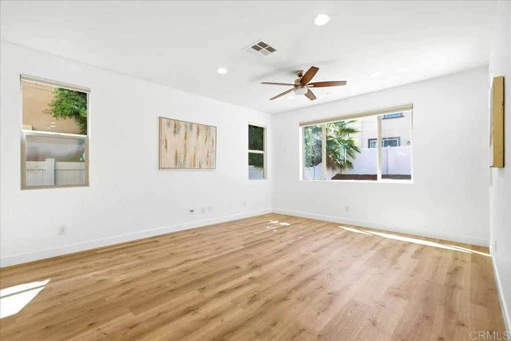 Bright, open living room with backyard access and seamless flow to the kitchen.