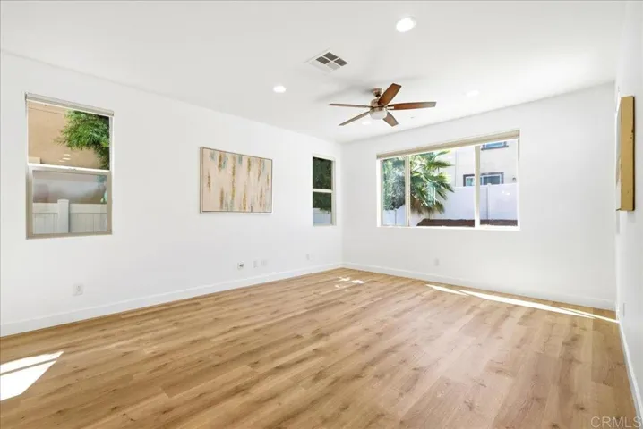 Bright, open living room with backyard access and seamless flow to the kitchen.