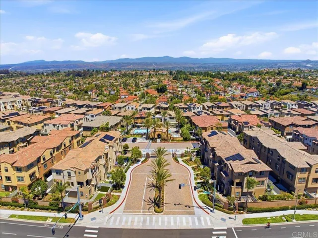 Aerial view showcasing the gated community and surrounding neighborhood.