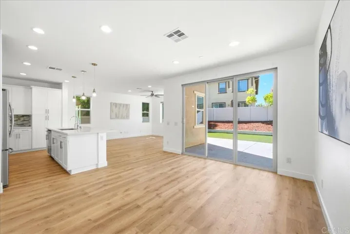 Open living area with backyard access and abundant natural light.