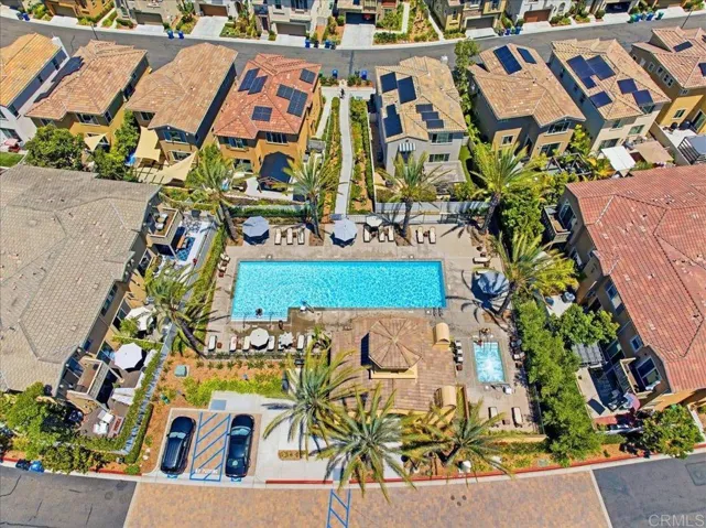 Overhead view of the community pool, spa, and outdoor lounge areas.