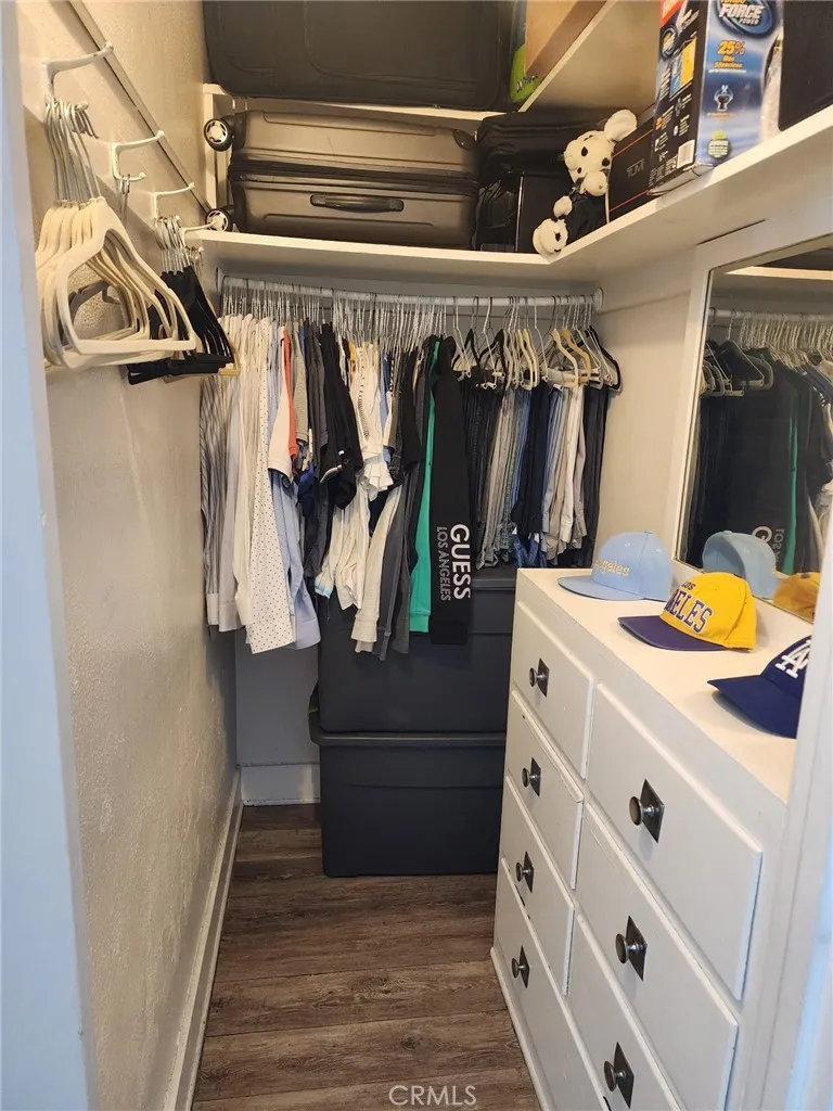 the other is a walk-in closet with a mirror on the door and drawers for clothing. All 1920's original- keeping the flavor of this 1922 building.