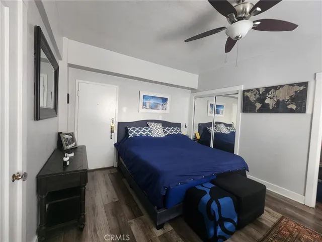 Another angle of the bed showing the ceiling fan.