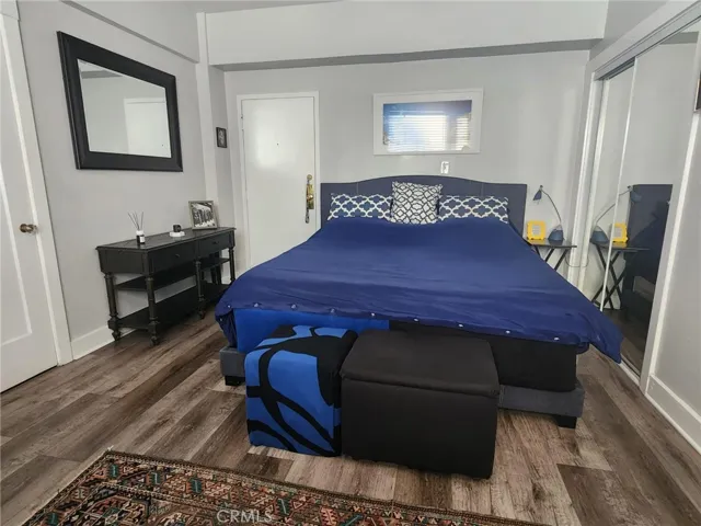 The king size bed has 2 closets. One is a large closet with sliding glass doors and...