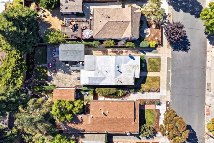 Expansive paved driveway and a separate detached garage structure