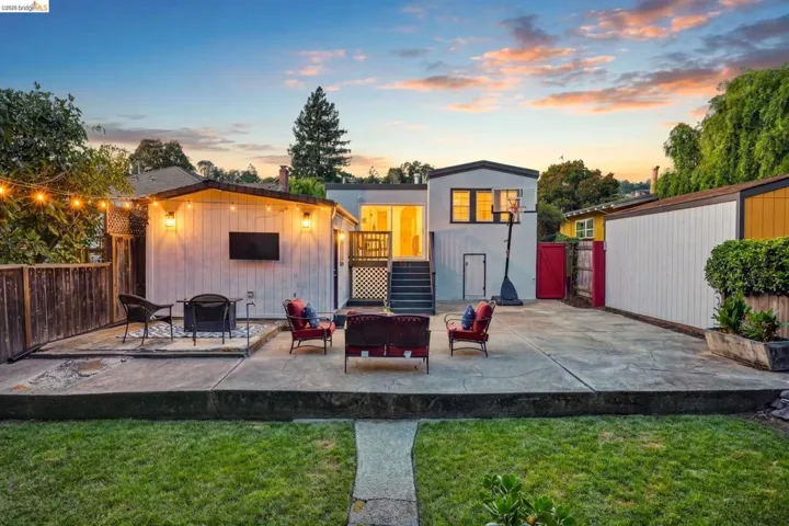 Expansive concrete patio offering multiple zones for outdoor living