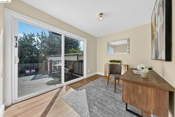 Sliding glass doors opening to an exterior wood deck