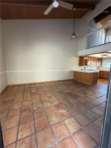 dining room with high ceilings and spanish tile flooring
