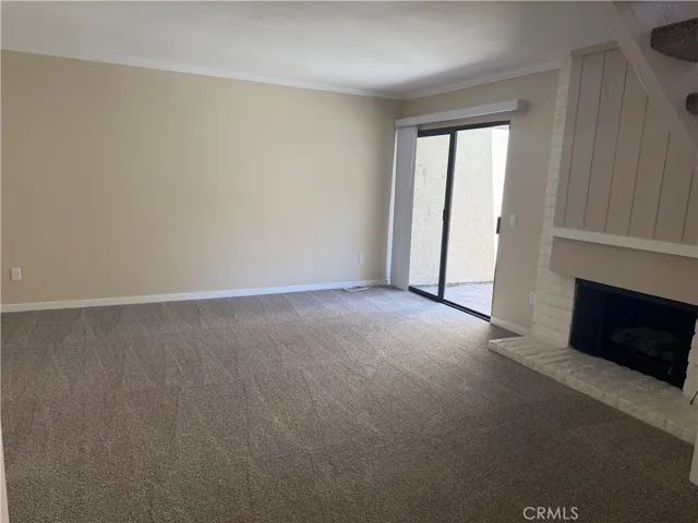 living room with fireplace and access to back patio