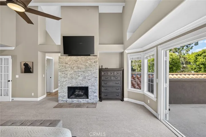 Main bedroom french doors open to oversized deck.