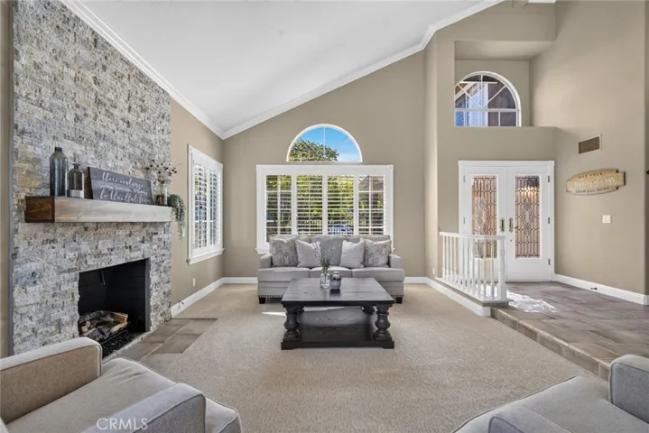 Custom renovated gas fireplace with under lighting below mantel