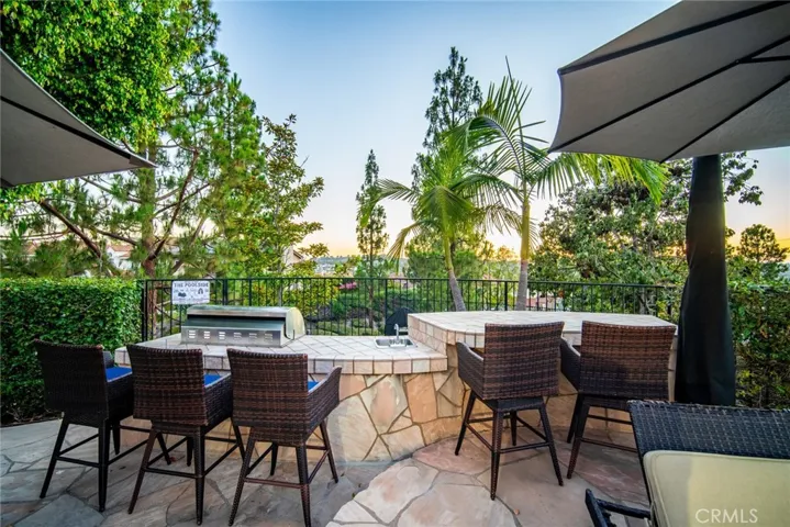 BBQ area equipped with sink, fridge and seating