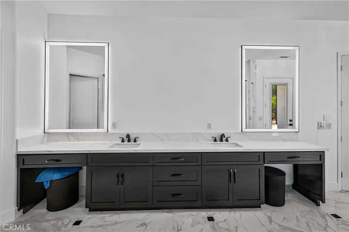 Primary bath vanities with heated mirrors