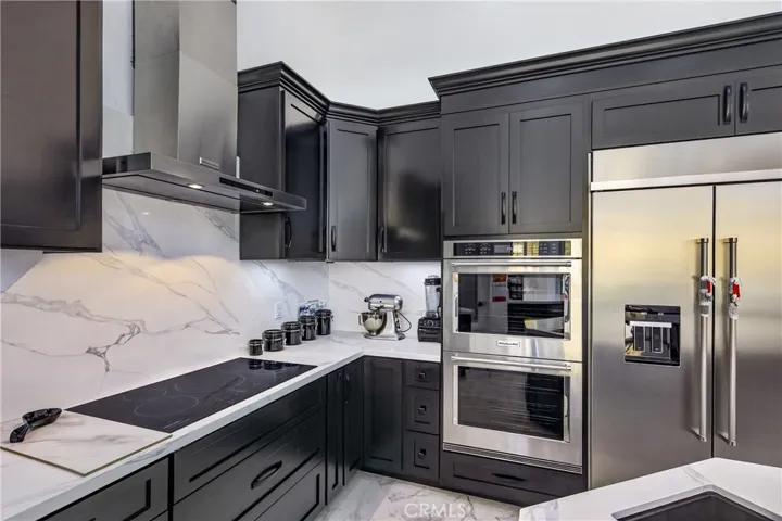 Built ins including refrigerator and inductive cook top