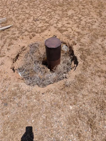 capped well near east side of lot. Looks like it is just over the property line on the neighbors 10 ac