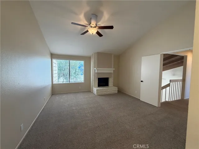 master bedroom with fireplace and double door entry