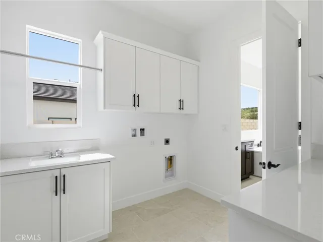 Laundry Room: Esen Modern Farmhouse - Bella Terra Collection at Tesoro - Photo of a different homesite of another Esen type floor plan - Not actual home for sale