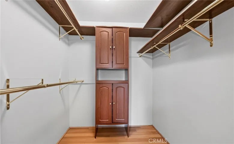 Walk in closet located in primary bedroom.