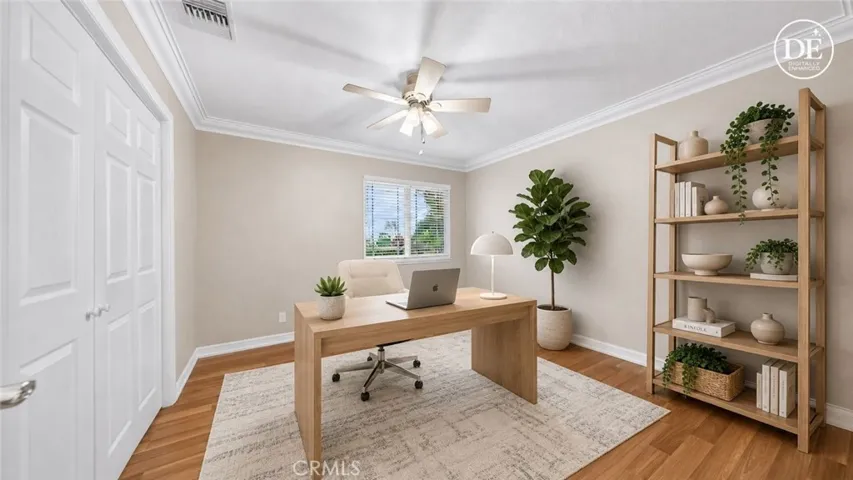 Fourth bedroom virtually staged as on office.