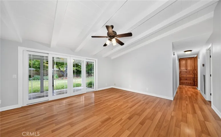 Family room with vaulted wood ceilings.