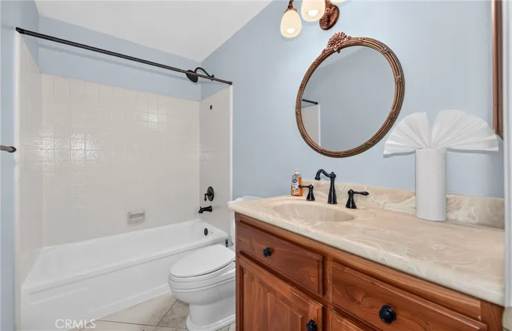 Second bathroom features shower and bathtub.