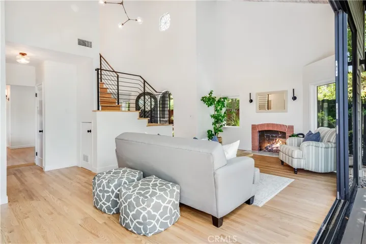 Great Room with Fireplace & Till Beamed Ceiling