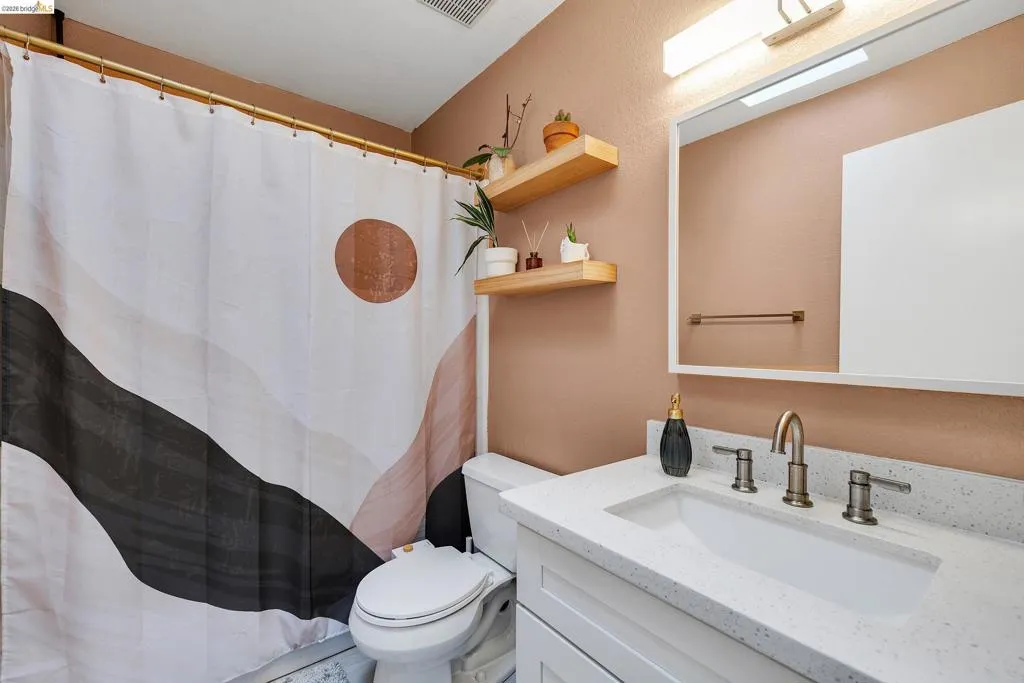 Bathroom with vanity and a shower with curtain