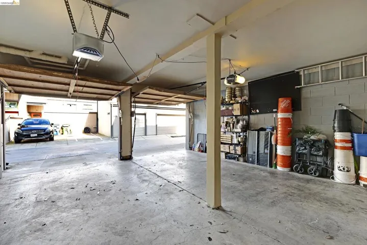 Garage with concrete block wall and a garage door opener
