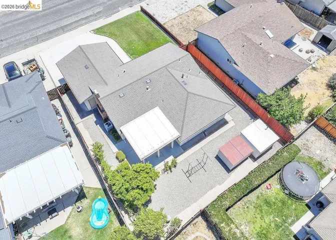 Single-story residence featuring a gray shingle roof and an attached garage