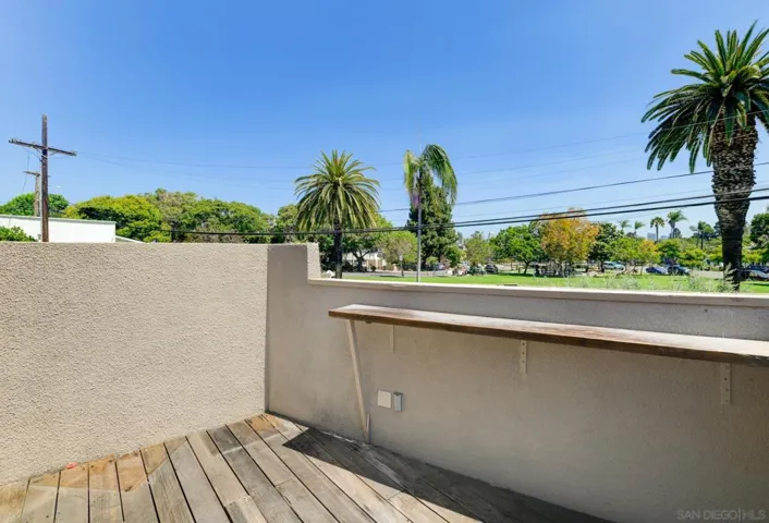 Deck off primary bedroom with views of Mathewson Park (Pomona Park).