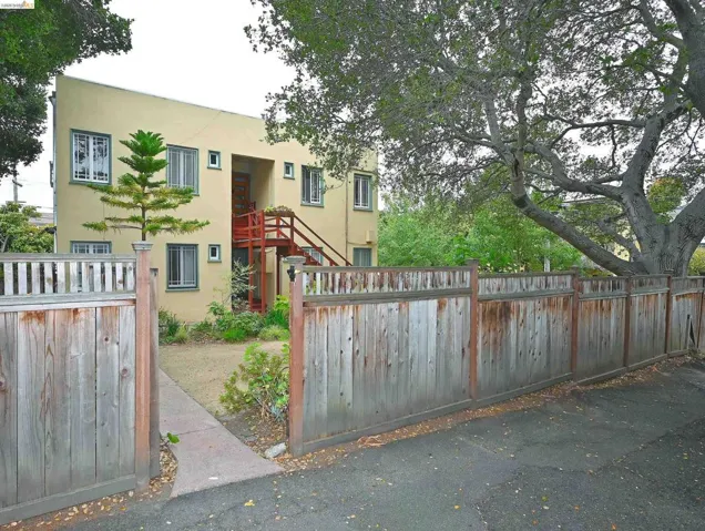 side gate opens to an alley.