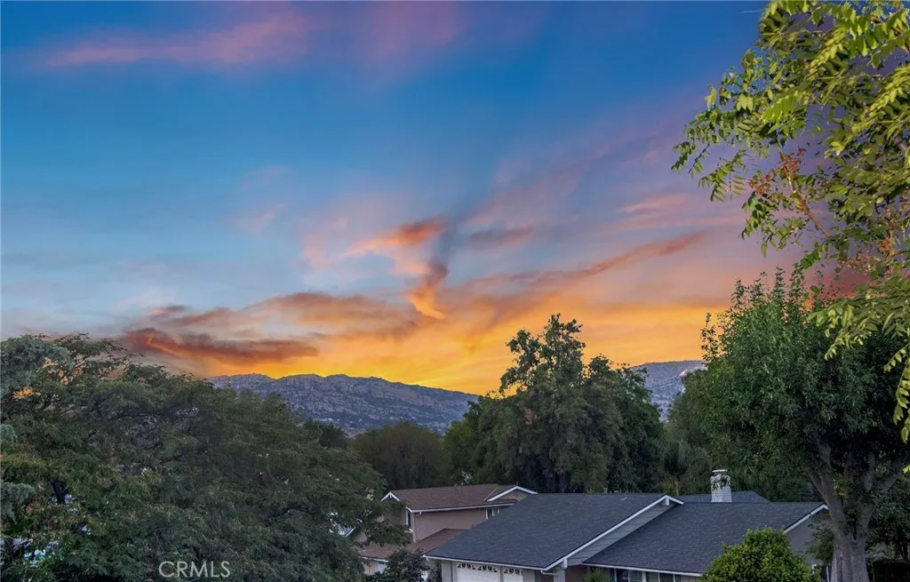 Upstairs, the generous primary suite offers a peaceful retreat where new vinyl windows frame unobstructed views of the treetops, surrounding hillsides, and West Hills neighborhoods.
